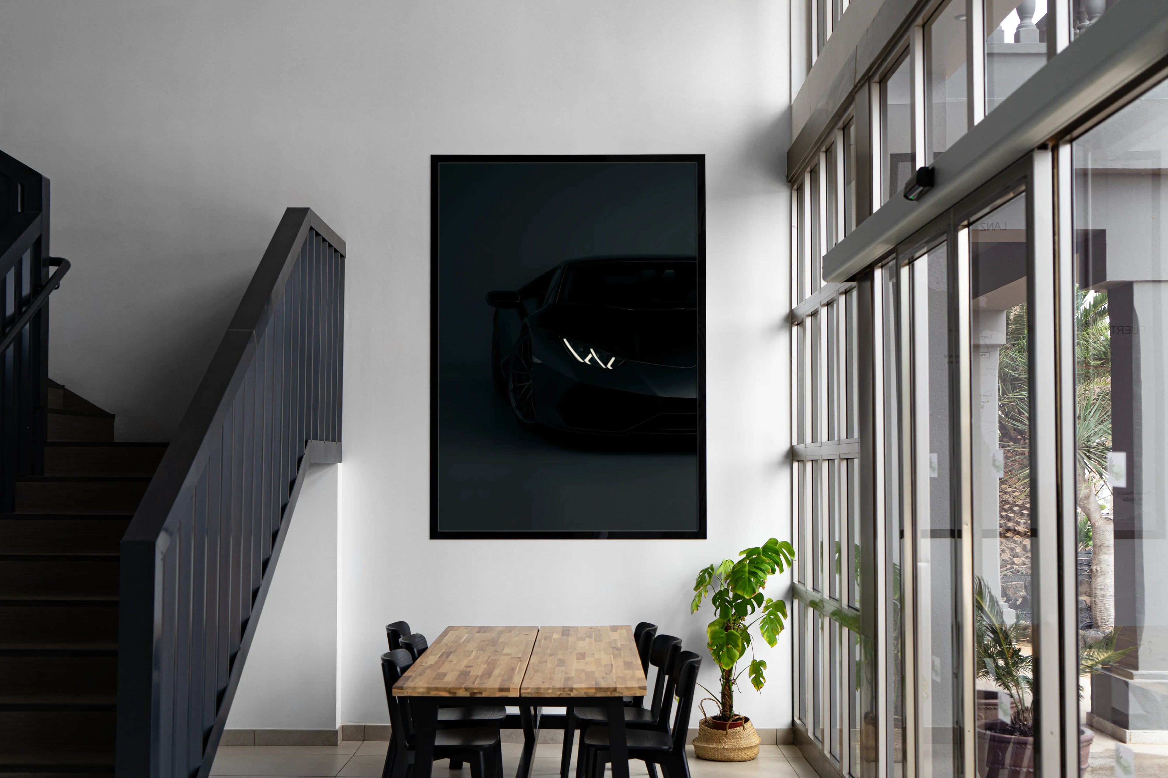 Framed stealth black supercar artwork in living room decor
