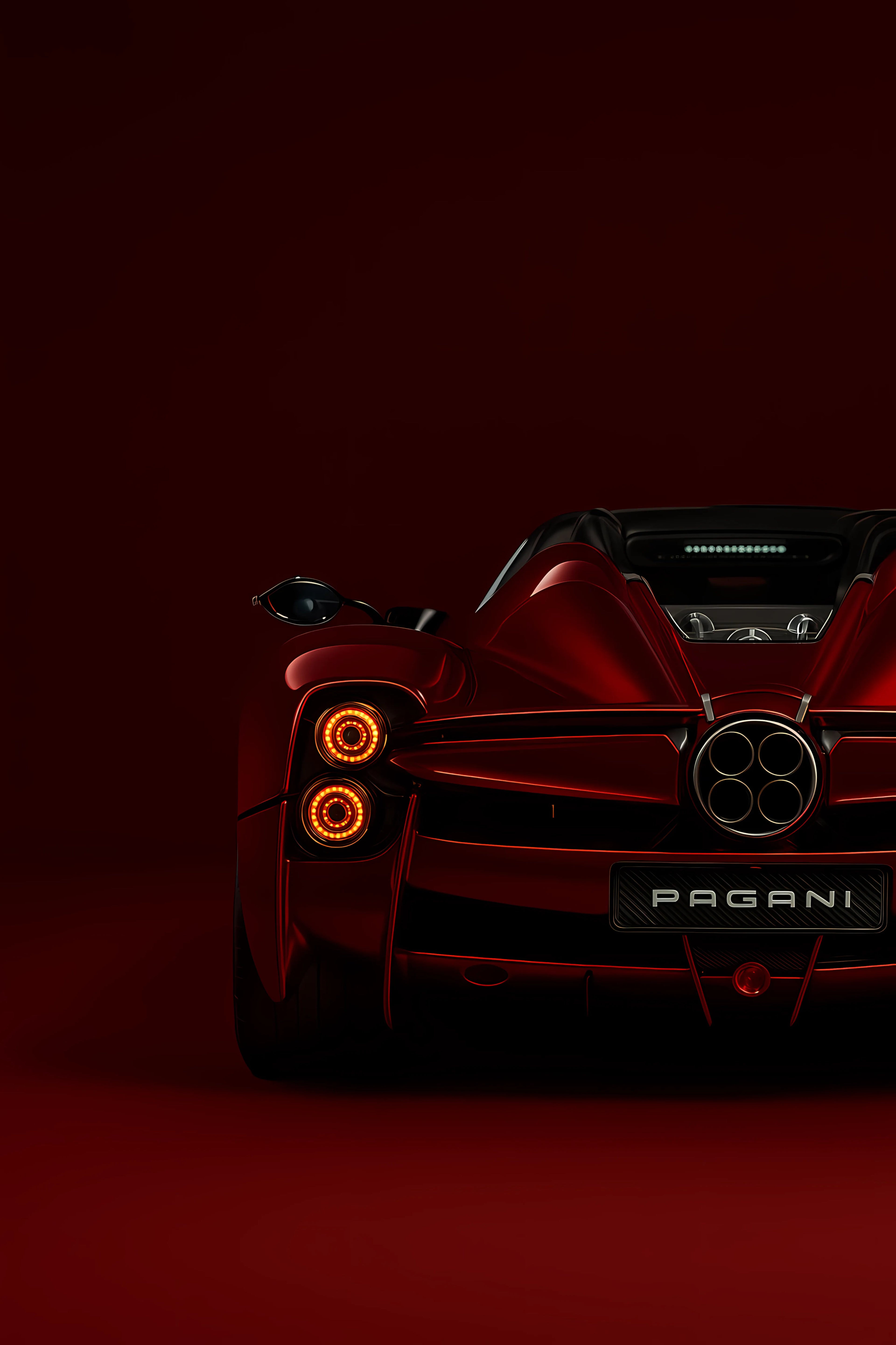 Red Pagani car with glowing orange headlights on a dark background